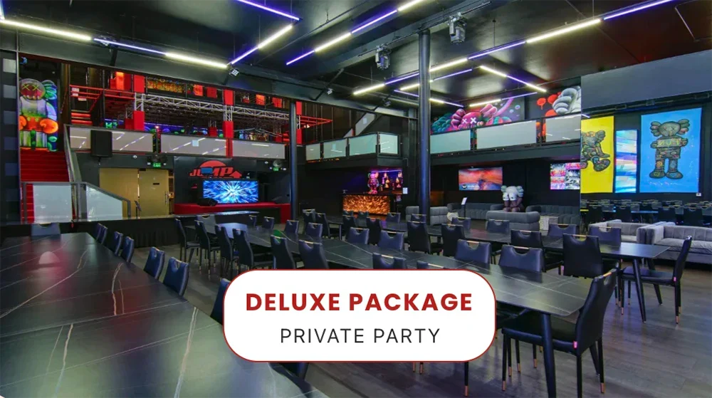 Modern event space with black chairs and tables, colorful wall art, neon lighting, and a stage; text overlay reads 