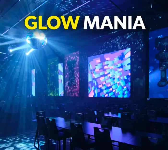 A dark room with colorful glowing lights and a disco ball shining light patterns on the walls and ceiling, with “GLOW MANIA” written at the top in bold yellow and white letters.
