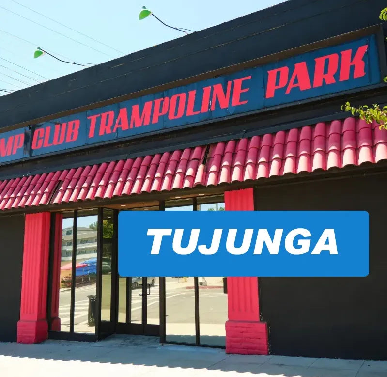 A building with a red and blue sign reading 